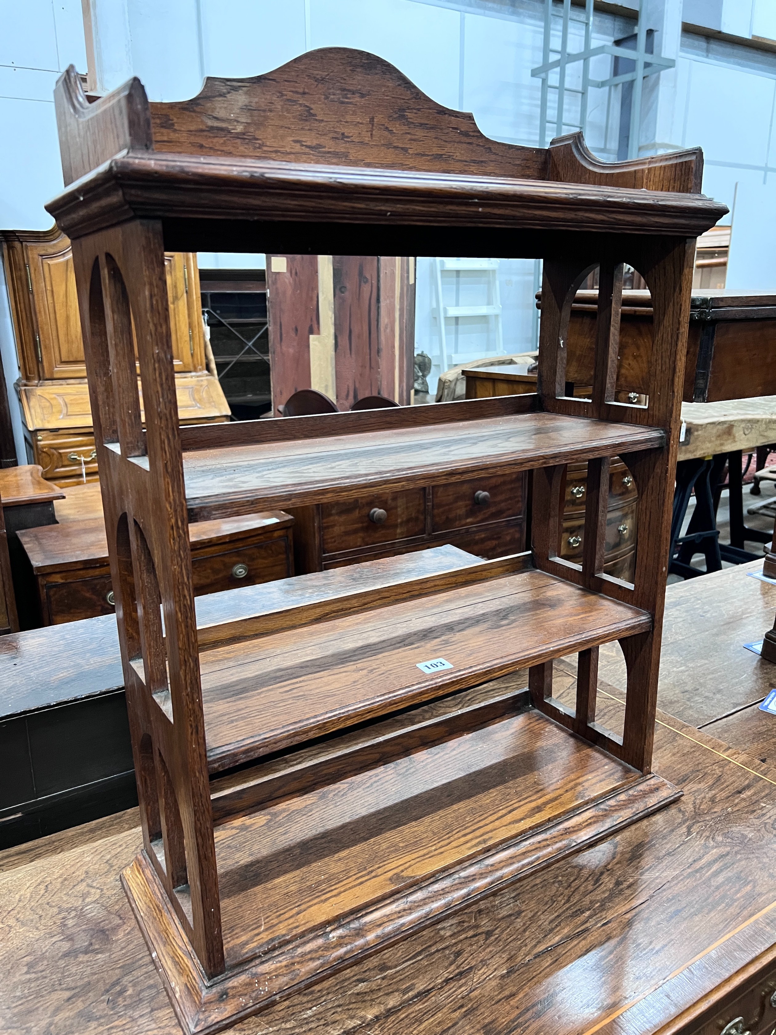 An Edwardian oak table top four tier open bookcase, width 62cm, depth 23cm, height 81cm *Please note the sale commences at 9am.